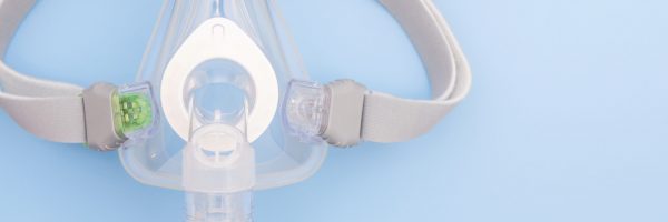 Sleep,Apnea,Cpap,Mask,On,Blue,Background.,Respiratory,Mask.