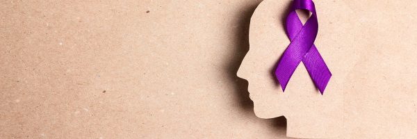 Purple,Awareness,Ribbon,And,Head,Silhouette,On,A,Brown,Cardboard
