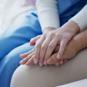 Close up hand of young asia woman or nurse home care holding senior grandmother